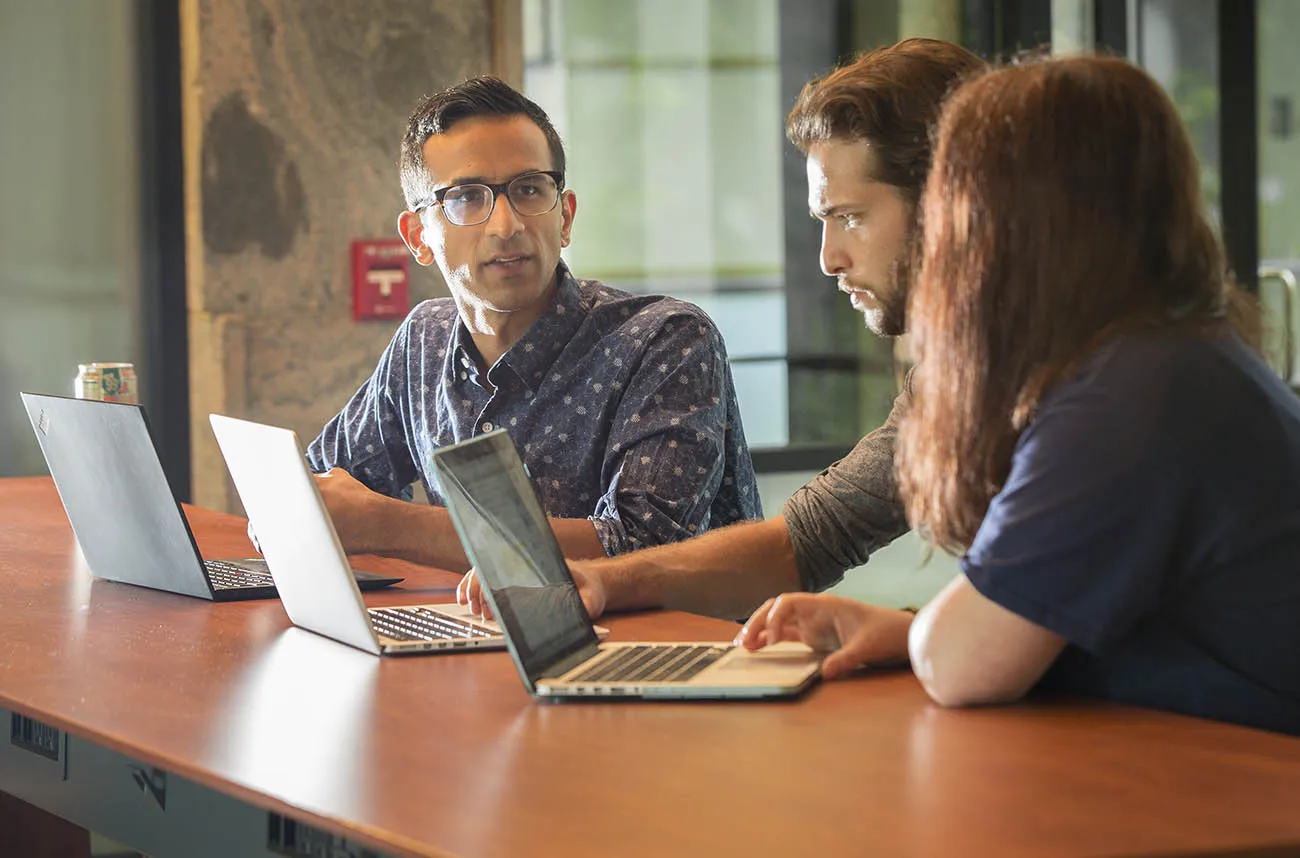 faculty talking with students