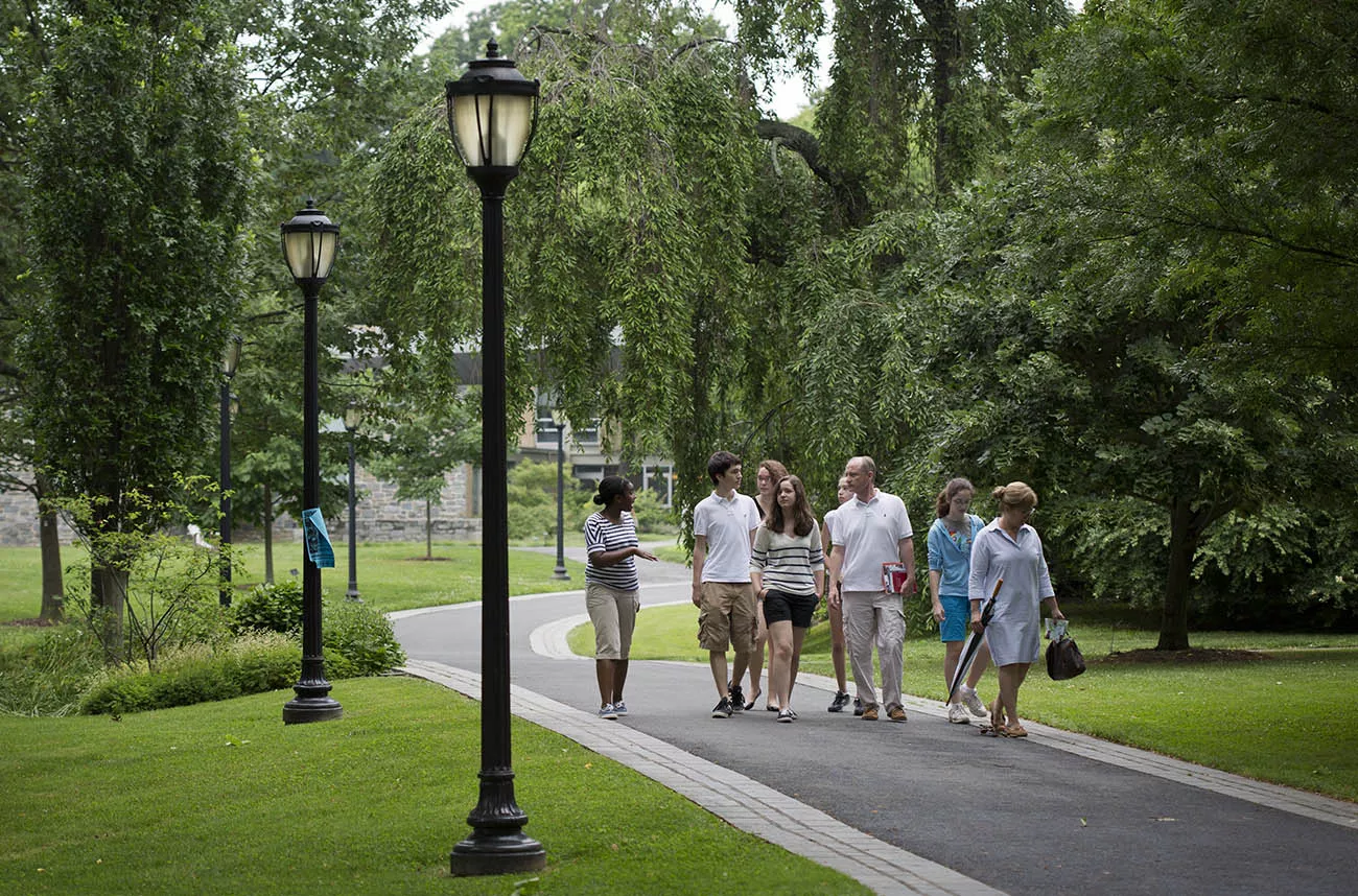 people walking on a campus path