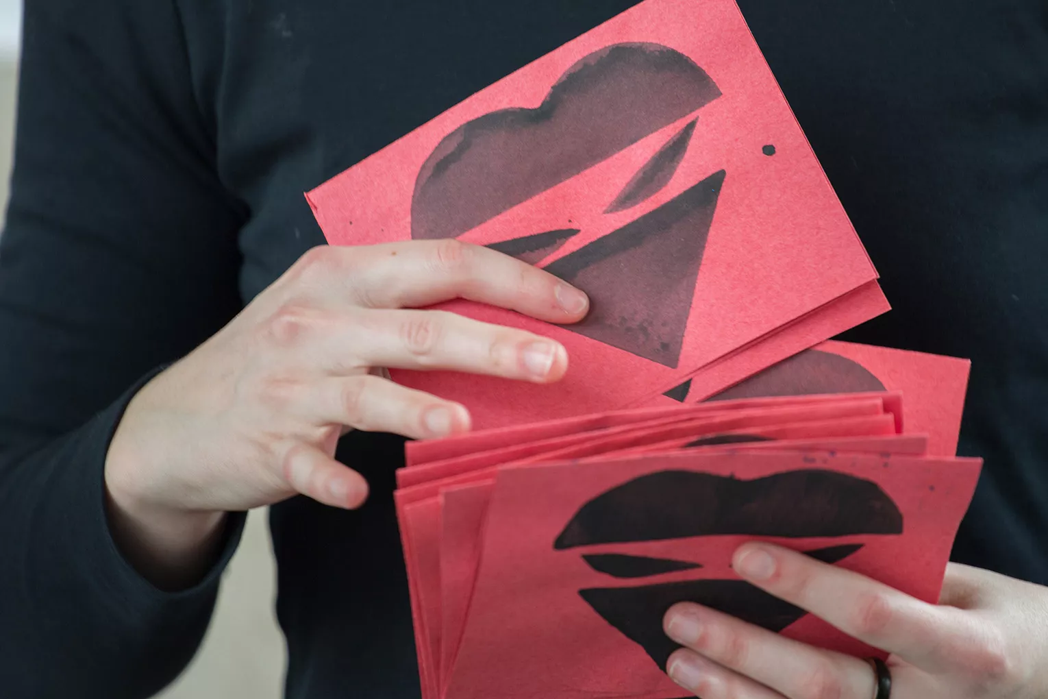 Red pieces of paper held by ninja