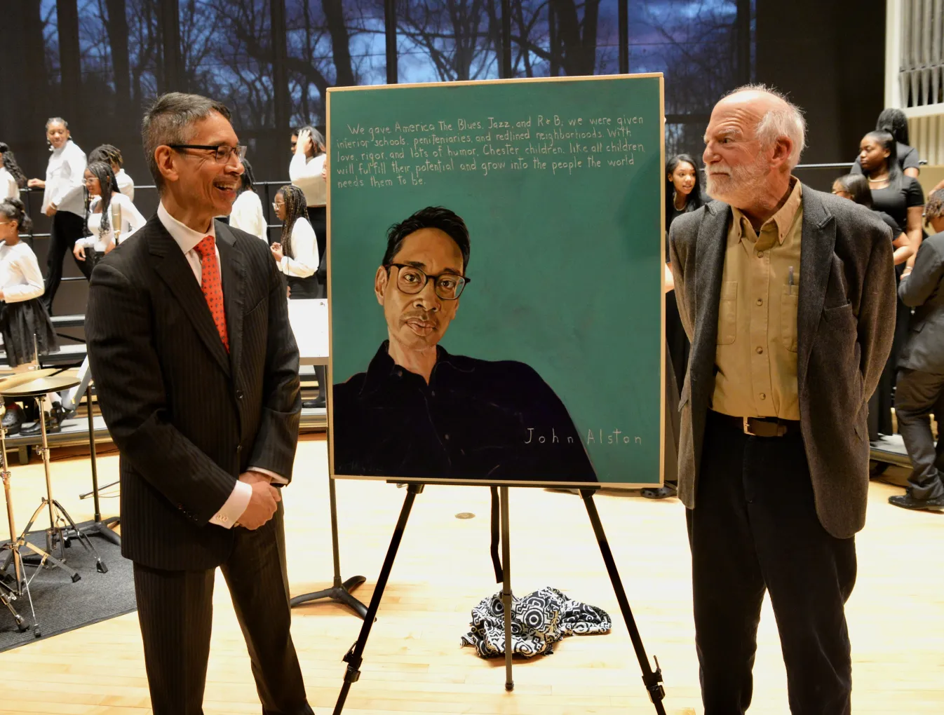 John Alston and Robert Shetterly standing in front of John Alston's portrait on easel