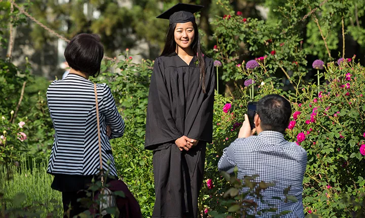 student in rose garden