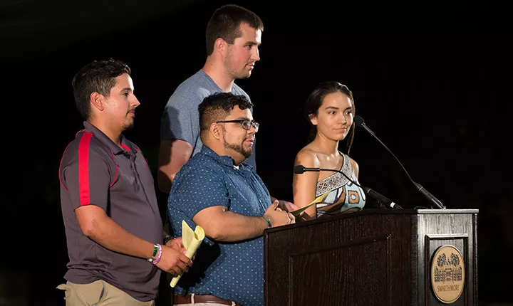 The senior class officers on stage at Last Collection