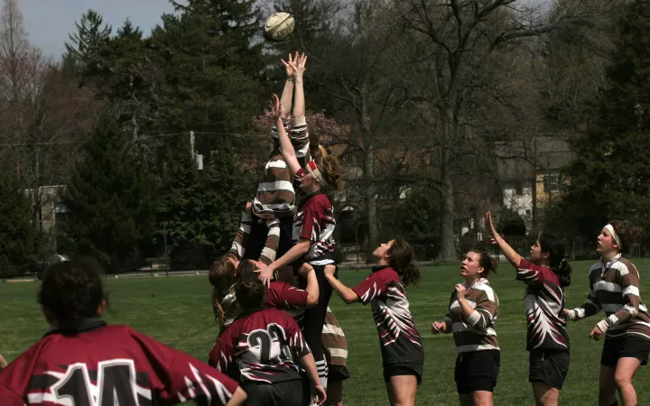 female students in a rugby match