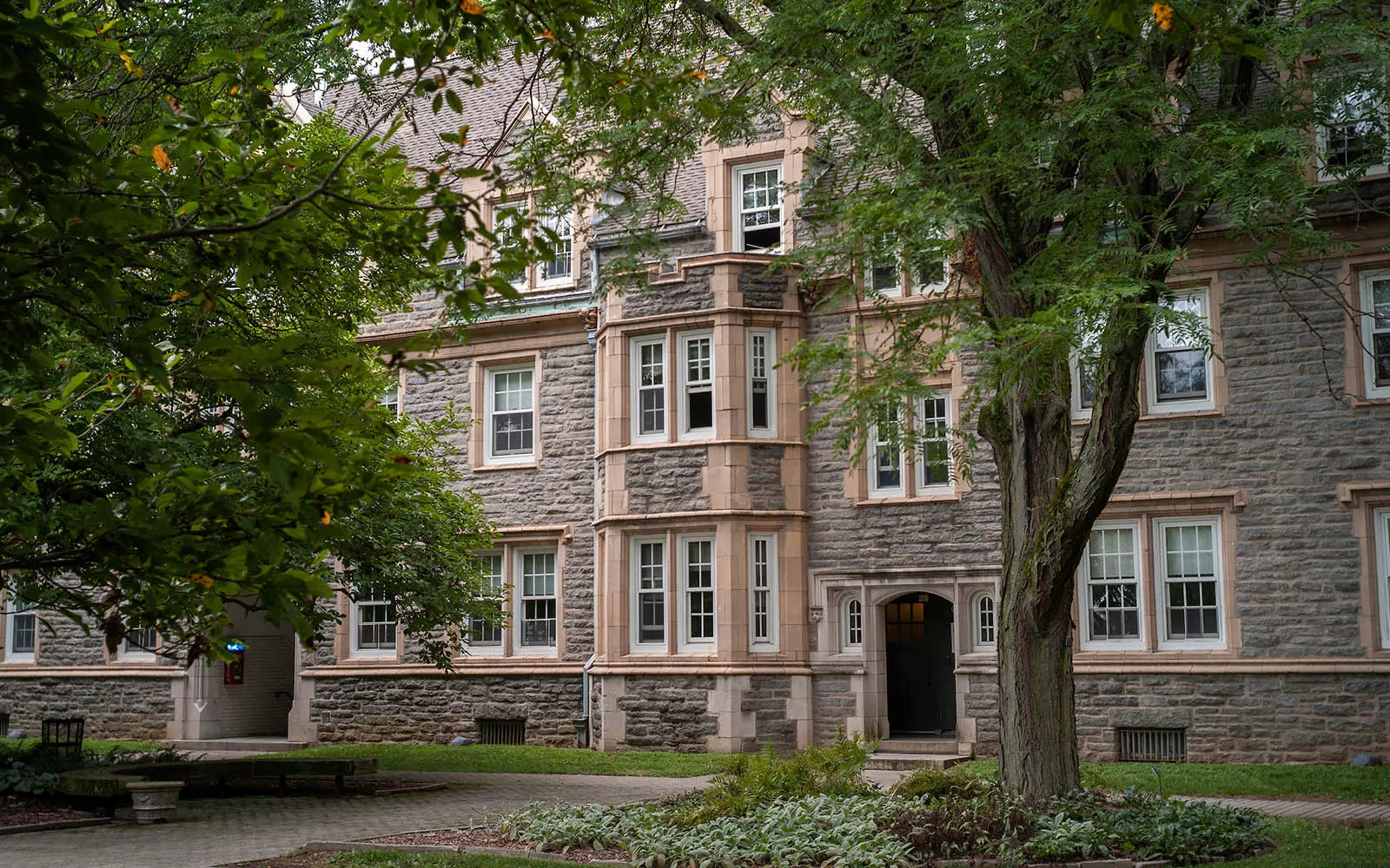 Exterior shot of Wharton Hall with trees in foreground