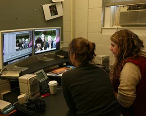 Students work on editing a film