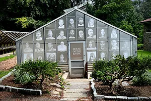 Greenhouse with images of homicide victims in window panes